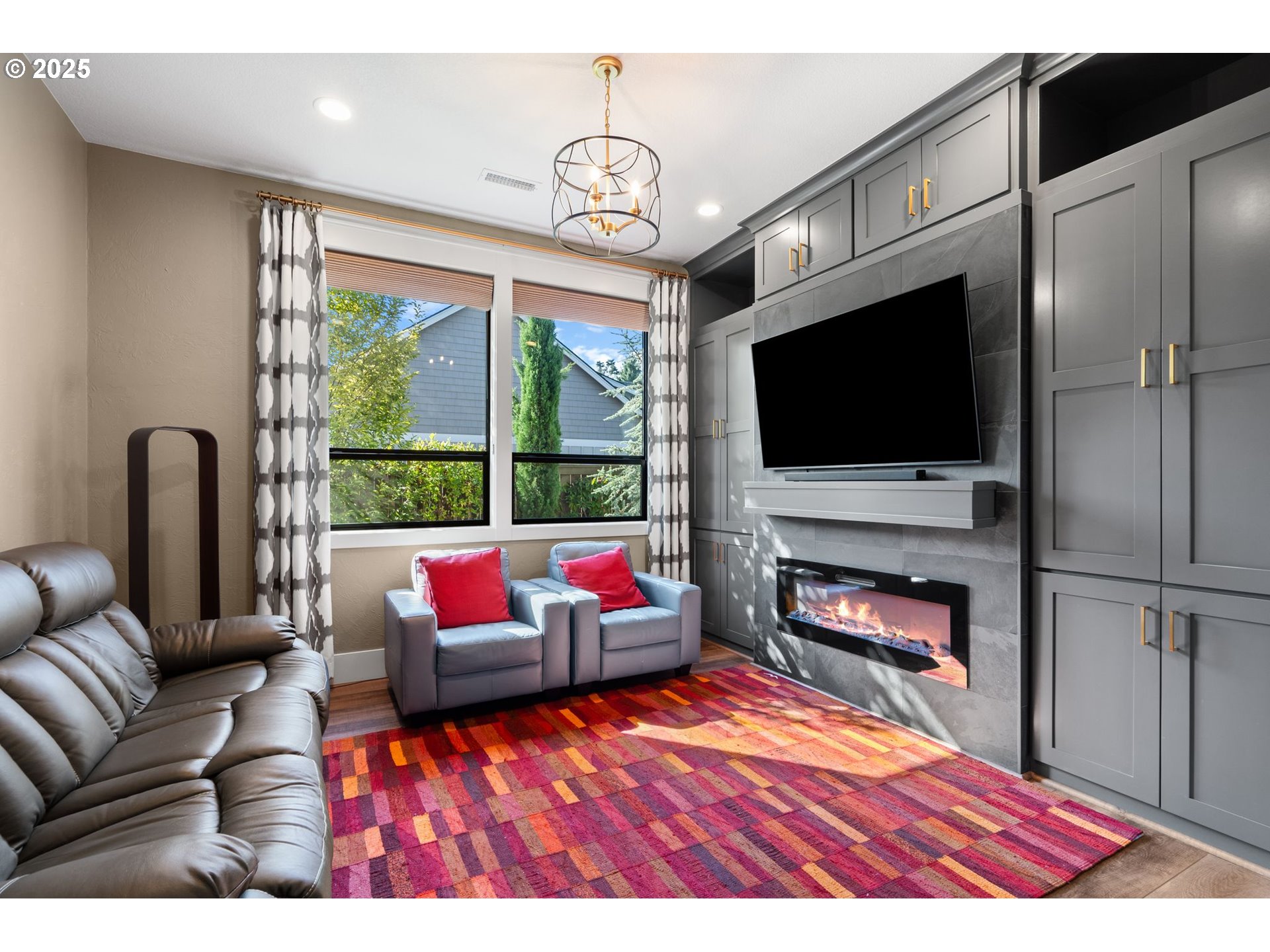 3911 Northwest 114th Street Vancouver, WA 98685 - Photo 19 of 30 a living room with furniture a flat screen tv and a fireplace