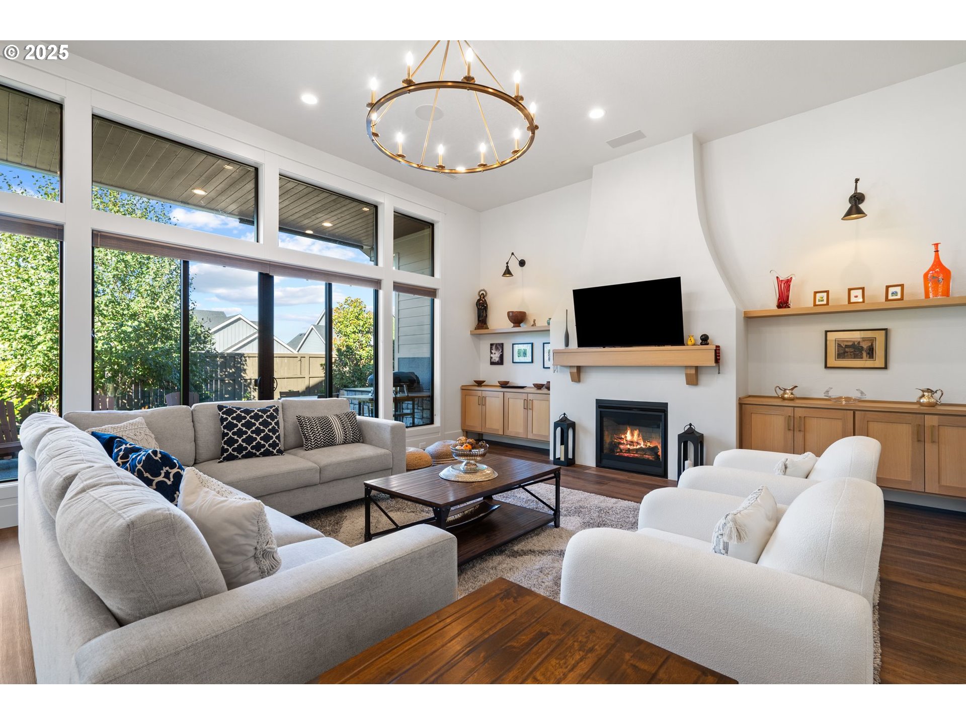 3911 Northwest 114th Street Vancouver, WA 98685 - Photo 2 of 30 a living room with furniture a fireplace and a large window