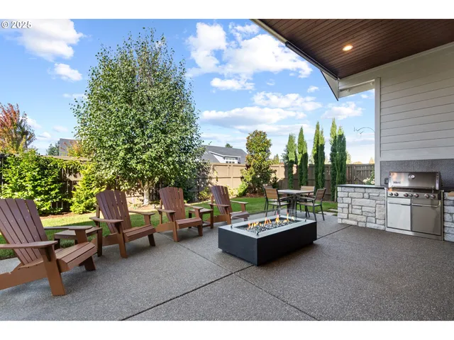 a view of a chairs and table in a patio