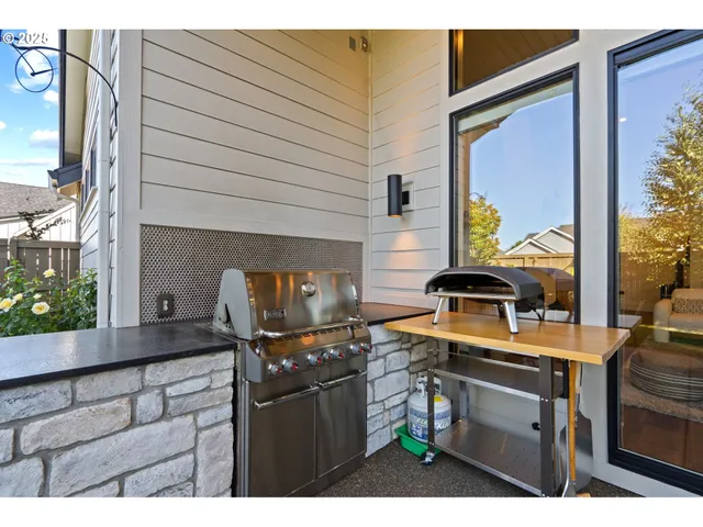 a view of a backyard with sitting area