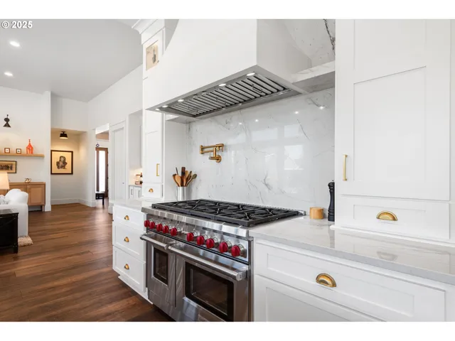 a kitchen with a refrigerator and a stove
