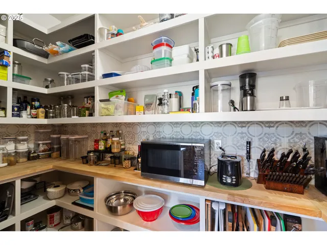 a dining room table in a hall with a large window