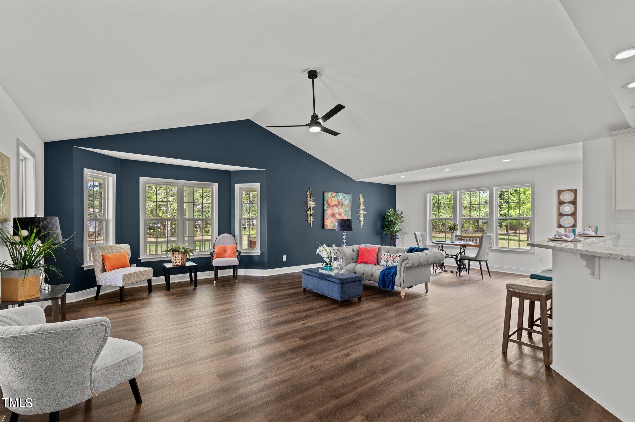 665 Lewis Road Zebulon, NC 27597 - Photo 12 of 29 a living room with furniture and a large window