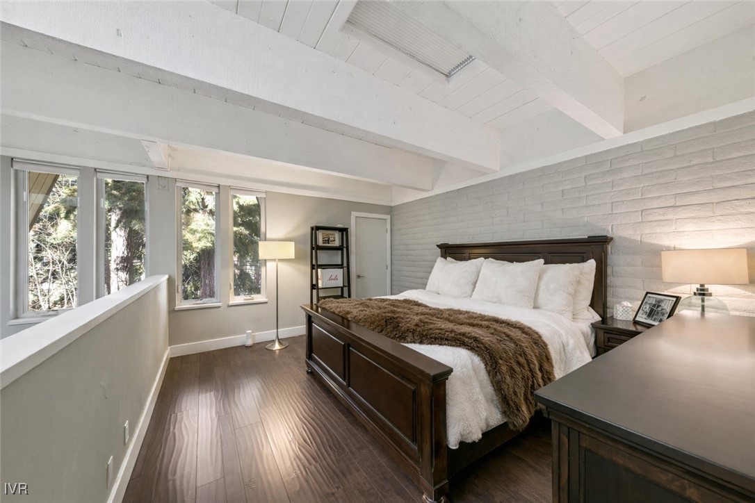 120 Country Club Drive, Unit 3 Incline Village, NV 89451 - Photo 13 of 38 a bed sitting in a bedroom next to a window