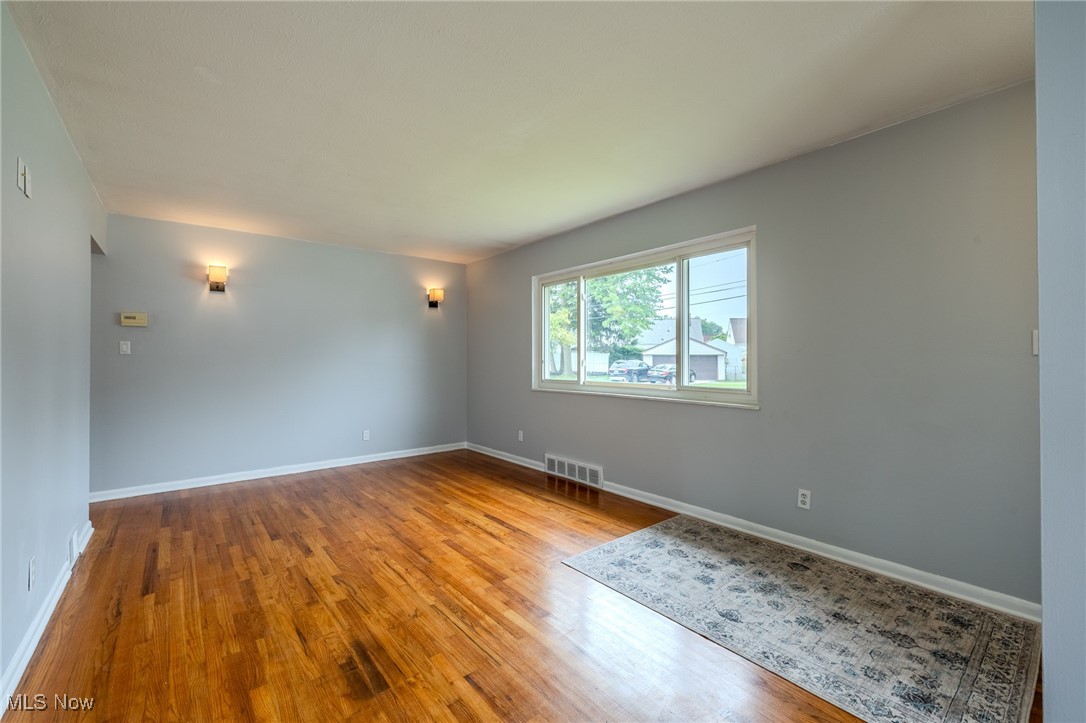 29971 Regent Road Wickliffe, OH 44092 - Photo 10 of 39 Spare room with wood finished floors and baseboards