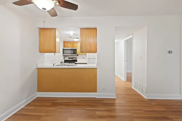a view of kitchen with wooden floor