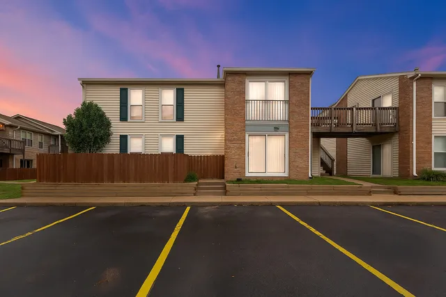 a view of swimming pool with brick walls