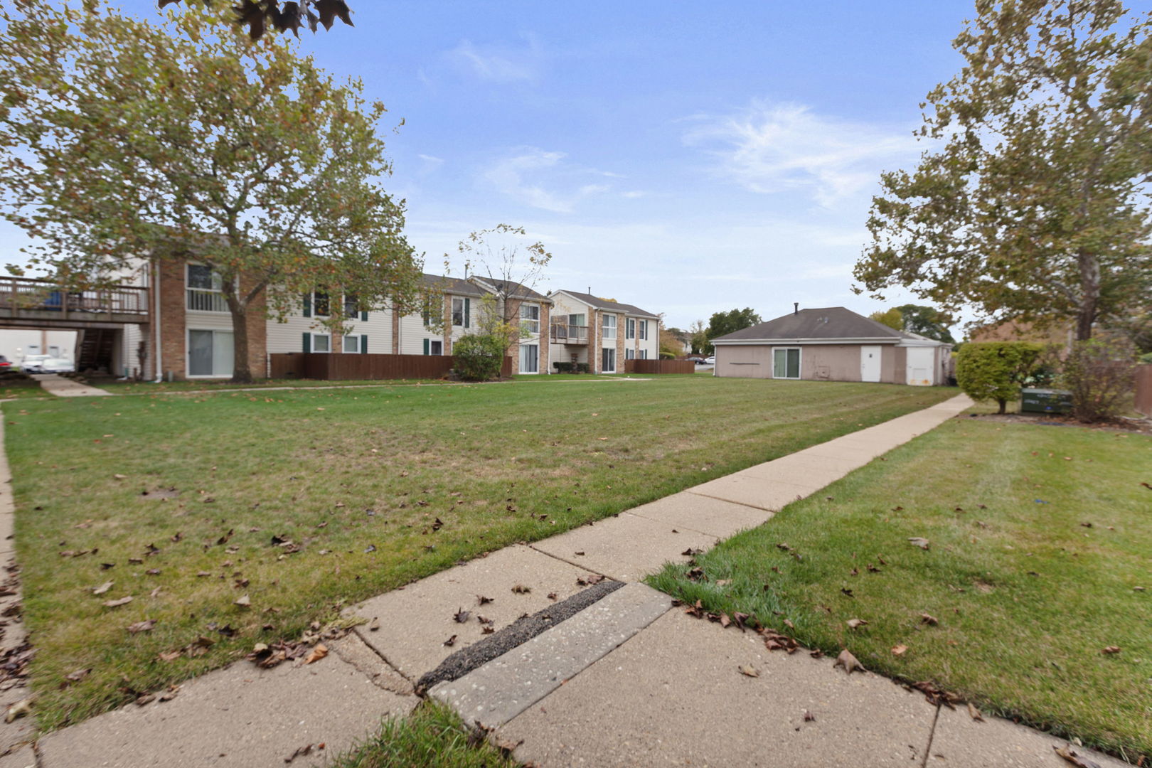 1975 Kenilworth Circle, Unit B Hoffman Estates, IL 60169 - Photo 21 of 21 a view of a big yard next to a yard