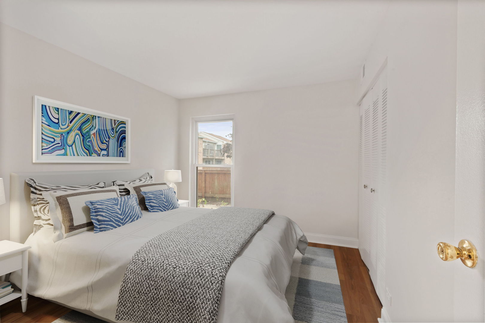 1975 Kenilworth Circle, Unit B Hoffman Estates, IL 60169 - Photo 7 of 21 a bedroom with a bed and a window