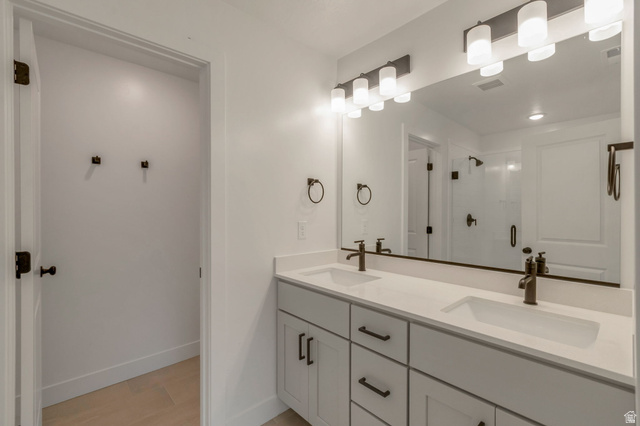 30 South Moonlit Road Mapleton, UT 84664 - Photo 13 of 25 En-suite bathroom. Dual vanity with integrated sinks and white countertops