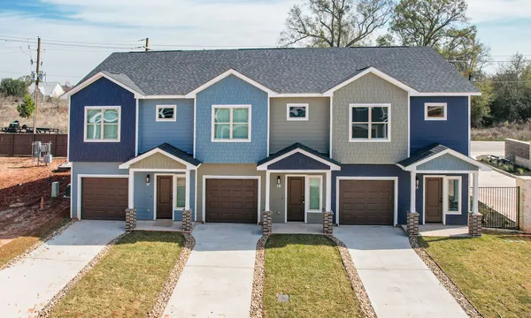 a front view of a house with yard porch and furniture