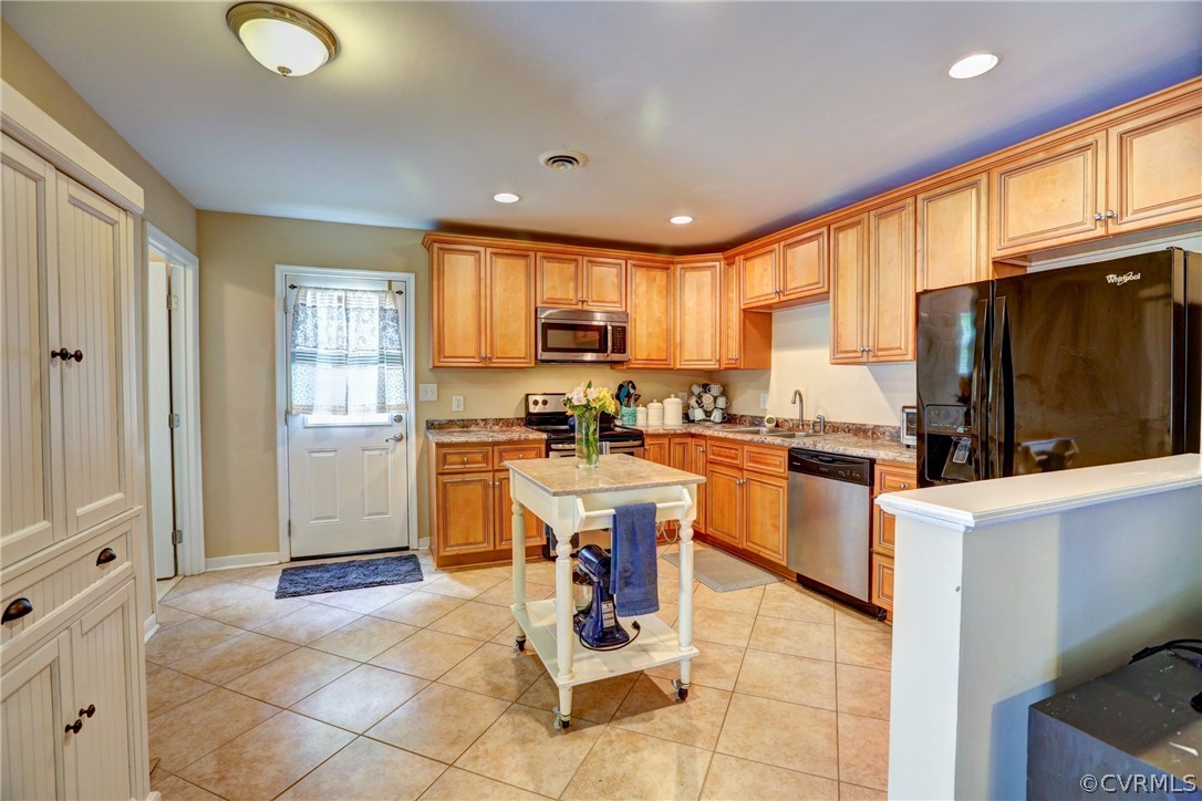 3909 Bronholly Road Chesterfield, VA 23832 - Photo 12 of 38 a kitchen with a refrigerator a stove cabinets and living room view