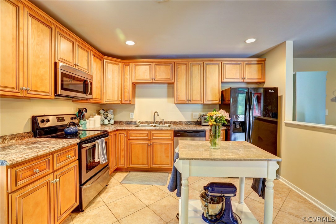 3909 Bronholly Road Chesterfield, VA 23832 - Photo 14 of 38 a kitchen with stainless steel appliances granite countertop a refrigerator and stove top oven