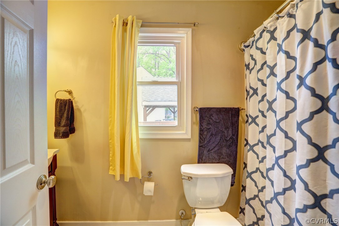 3909 Bronholly Road Chesterfield, VA 23832 - Photo 26 of 38 a bathroom with a toilet and a shower curtain