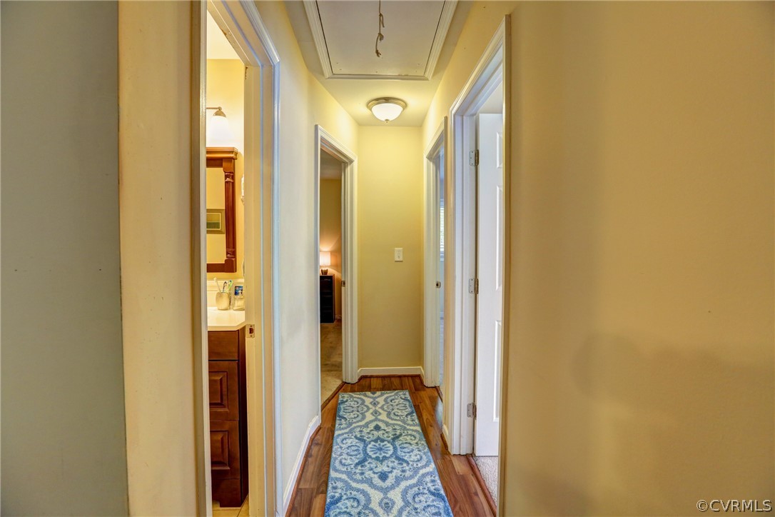3909 Bronholly Road Chesterfield, VA 23832 - Photo 27 of 38 a view of hallway with wooden floor and a bathroom