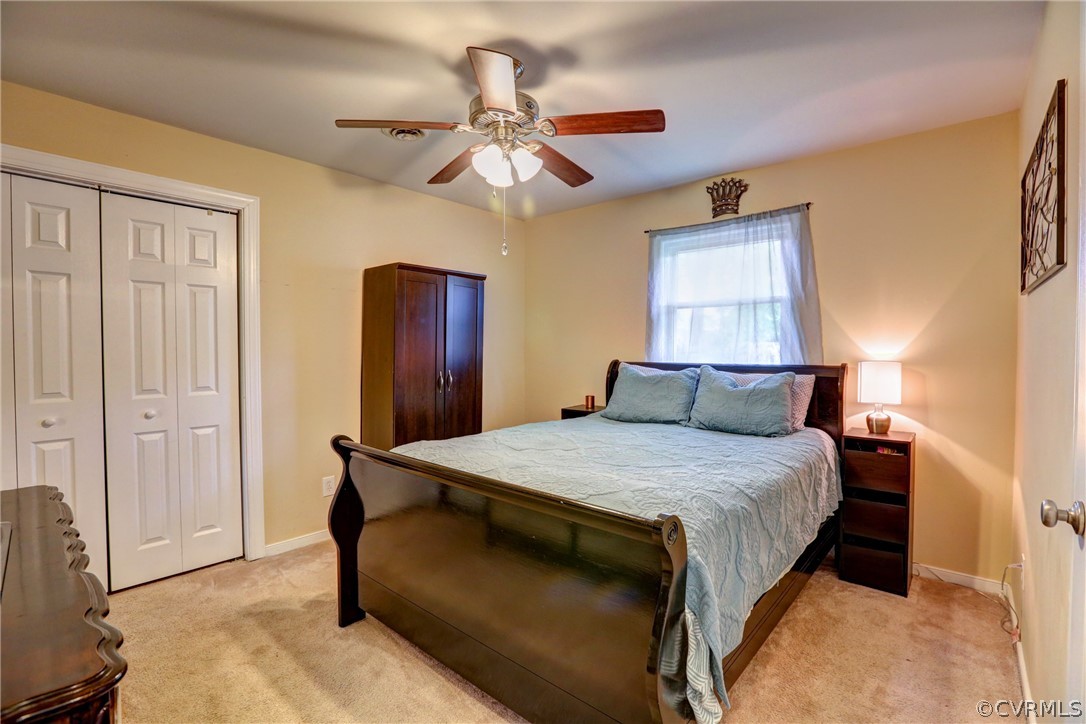 3909 Bronholly Road Chesterfield, VA 23832 - Photo 28 of 38 a bedroom with a bed and a dresser