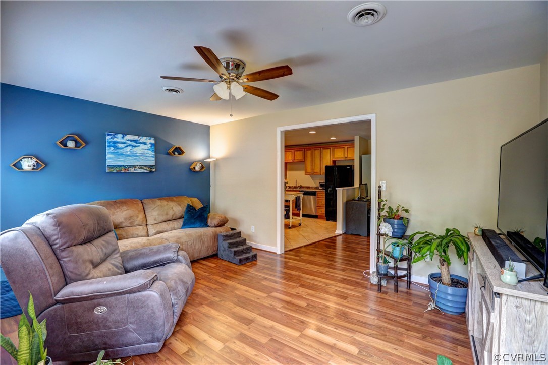 3909 Bronholly Road Chesterfield, VA 23832 - Photo 9 of 38 a living room with furniture and a flat screen tv