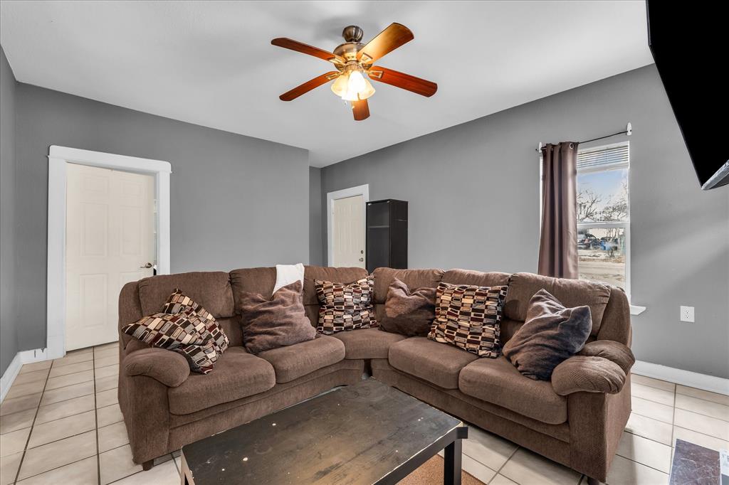 1822 Herring Avenue Waco, TX 76708 - Photo 3 of 26 a living room with furniture and a flat screen tv