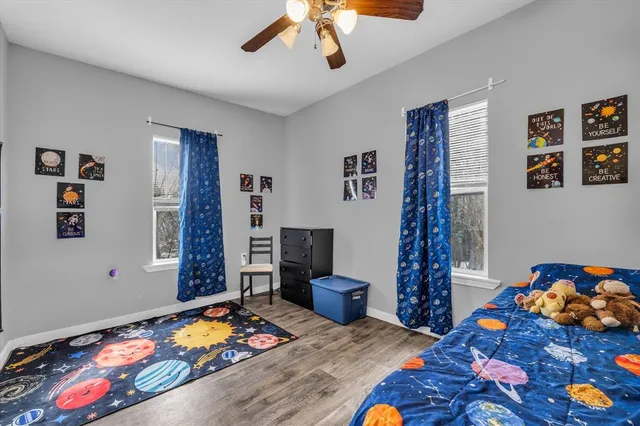 a bedroom with bed and a window