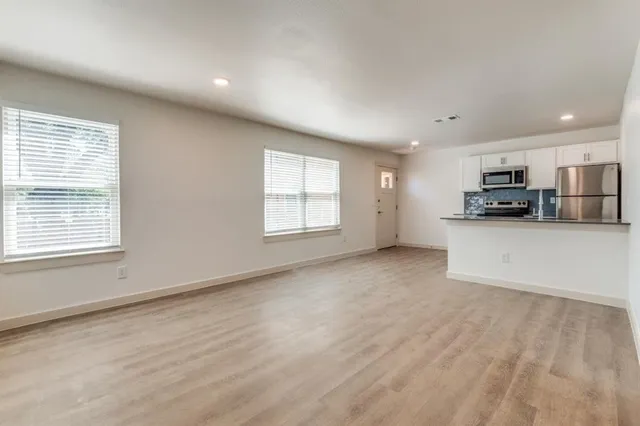 a view of a kitchen with furniture and a window