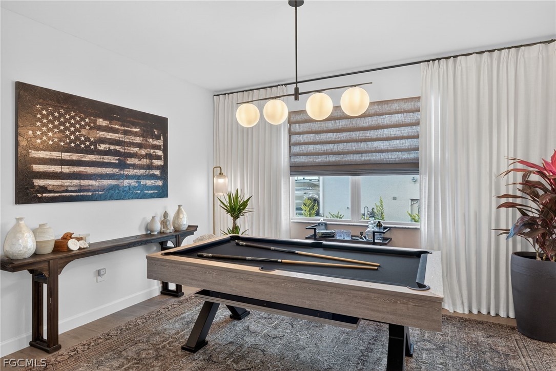 14598 Lagoon Drive Punta Gorda, FL 33982 - Photo 12 of 46 a living room with a table and a window