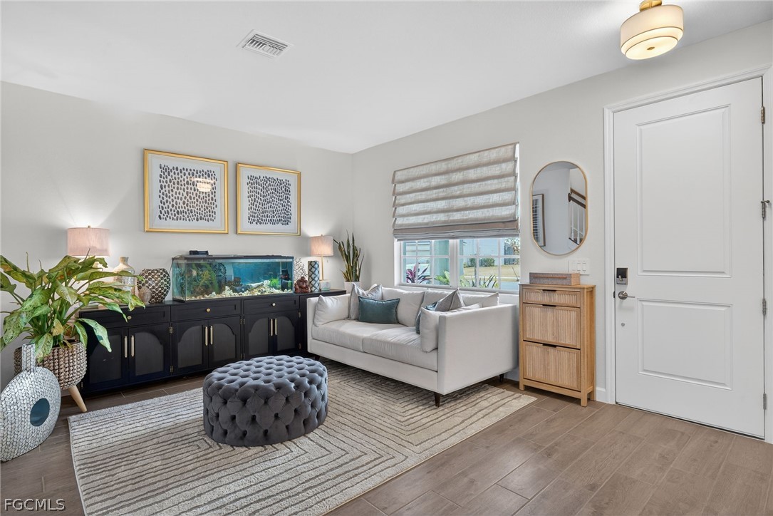 14598 Lagoon Drive Punta Gorda, FL 33982 - Photo 14 of 46 a living room with furniture and a window