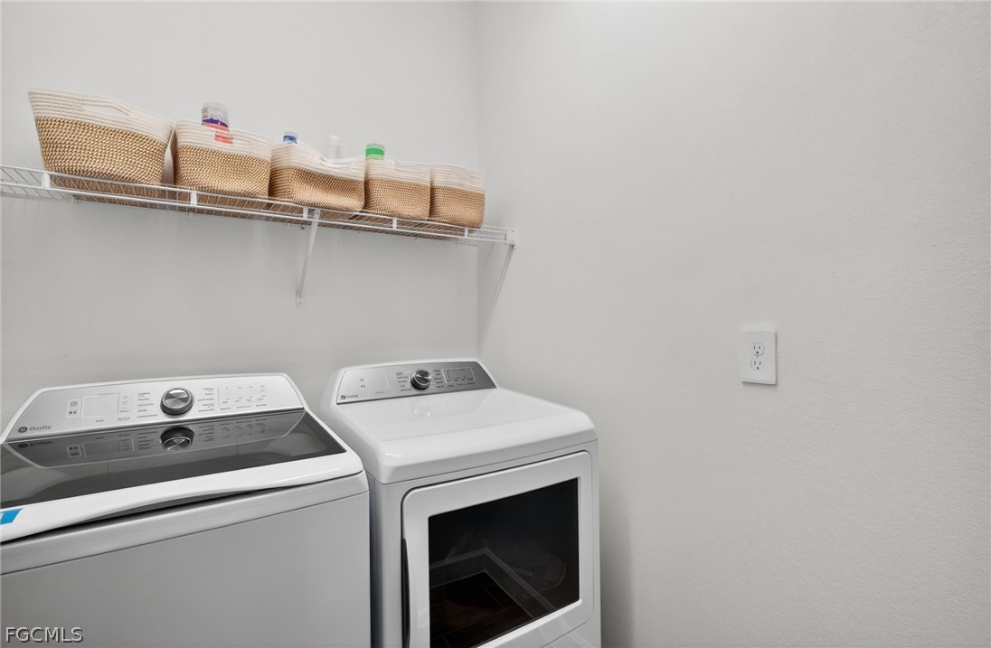 14598 Lagoon Drive Punta Gorda, FL 33982 - Photo 17 of 46 a utility room with dryer and washer