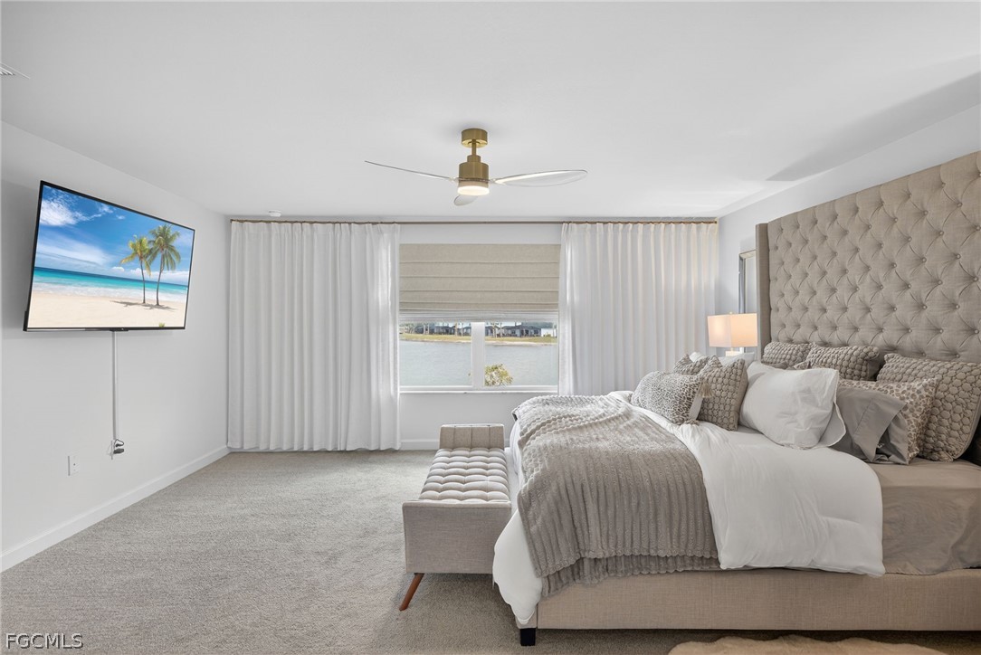 14598 Lagoon Drive Punta Gorda, FL 33982 - Photo 24 of 46 a bedroom with a large bed and a window