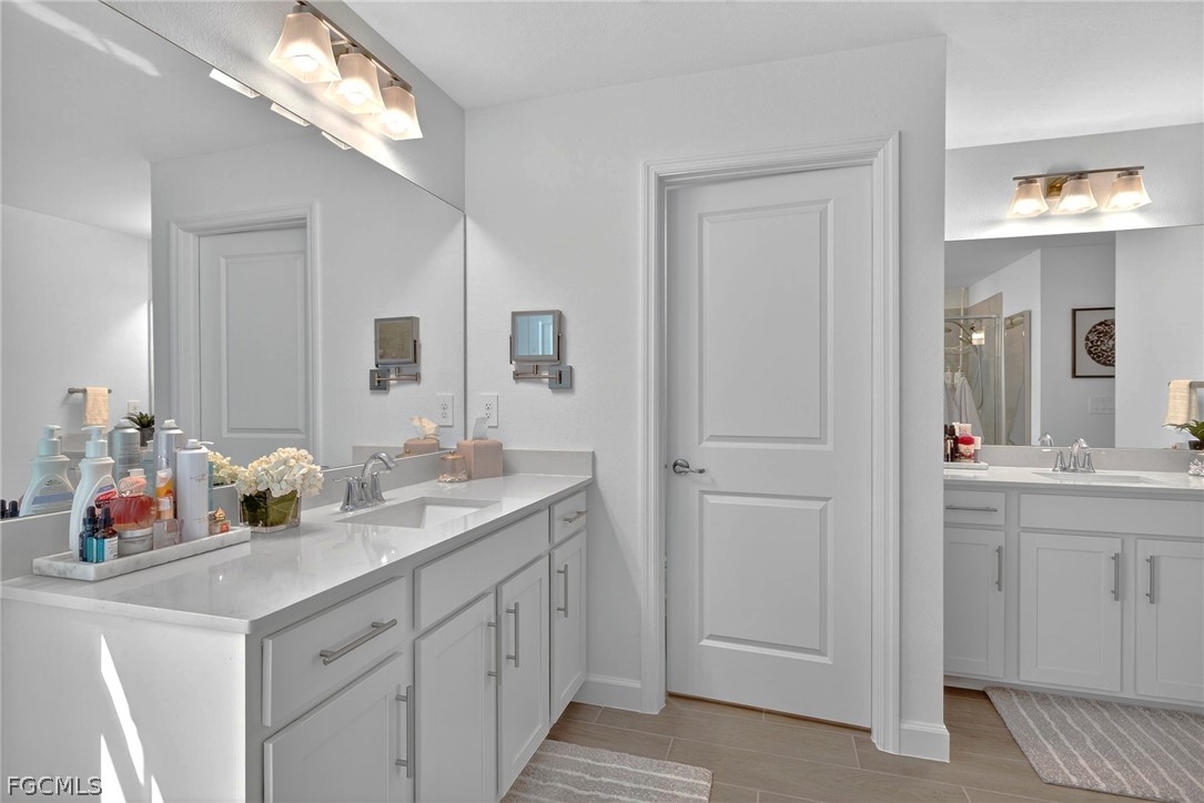 14598 Lagoon Drive Punta Gorda, FL 33982 - Photo 26 of 46 a bathroom with a sink and a mirror