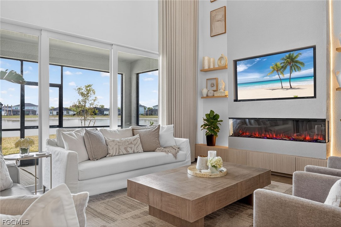 14598 Lagoon Drive Punta Gorda, FL 33982 - Photo 3 of 46 a living room with furniture and a large window