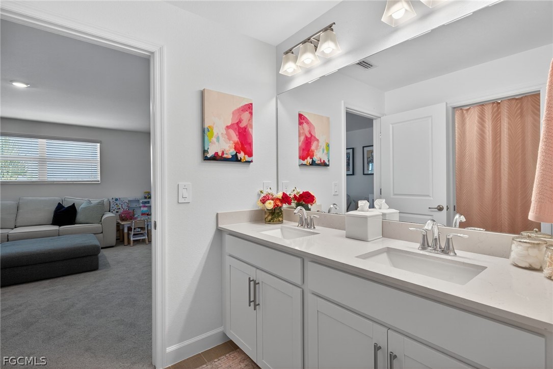 14598 Lagoon Drive Punta Gorda, FL 33982 - Photo 33 of 46 a bathroom with a sink and a mirror