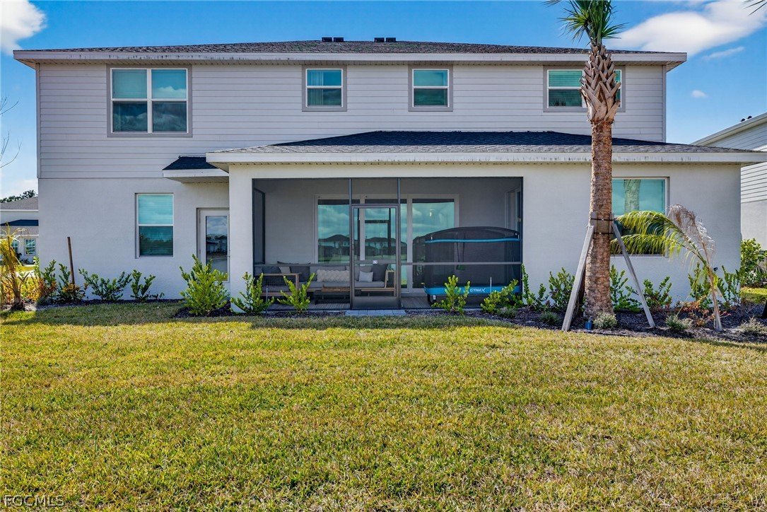 14598 Lagoon Drive Punta Gorda, FL 33982 - Photo 36 of 46 a front view of a house with garden