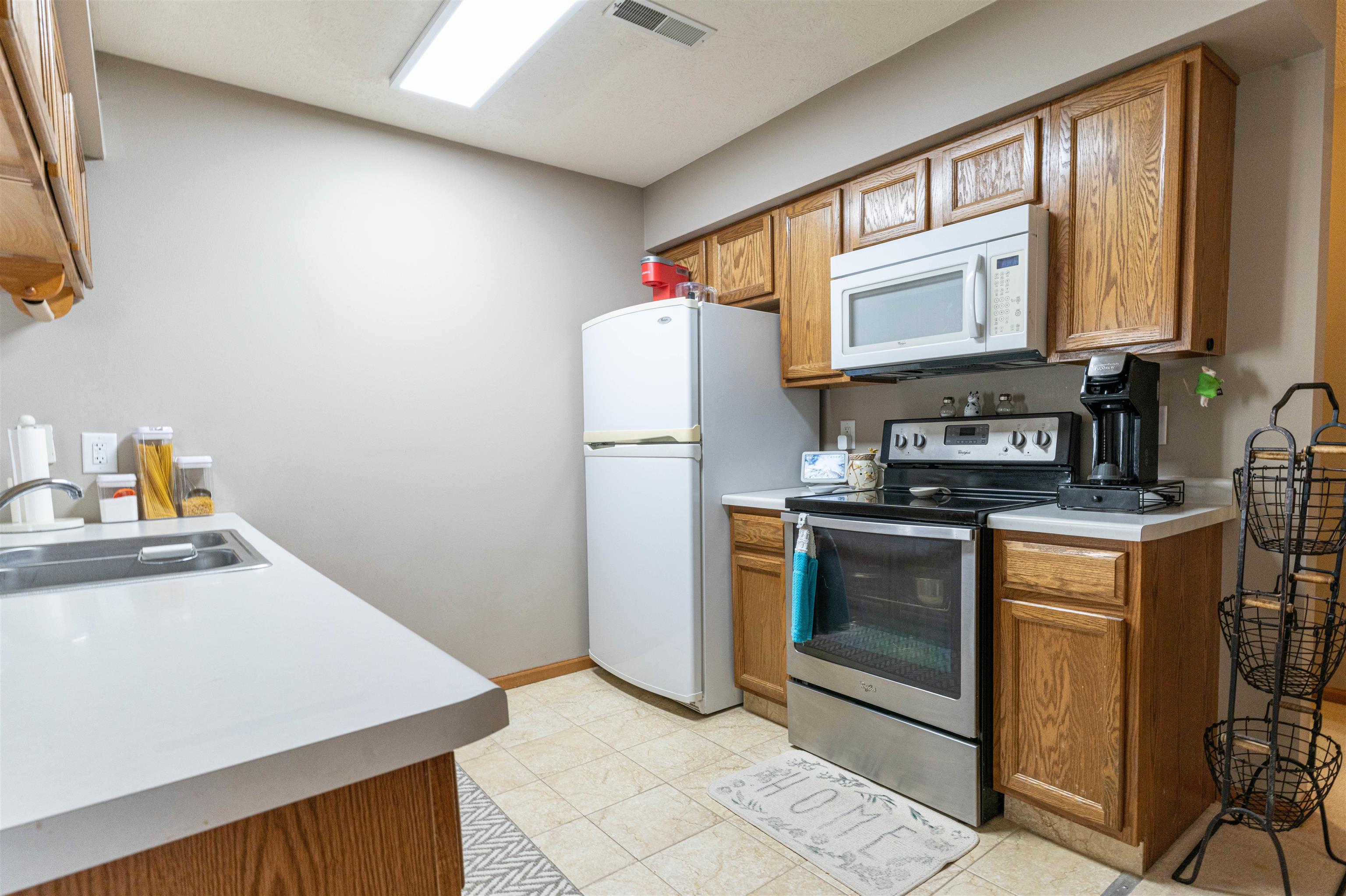 6502 Timberleaf Court Loves Park, IL 61111 - Photo 14 of 23 a kitchen with a refrigerator sink and stove