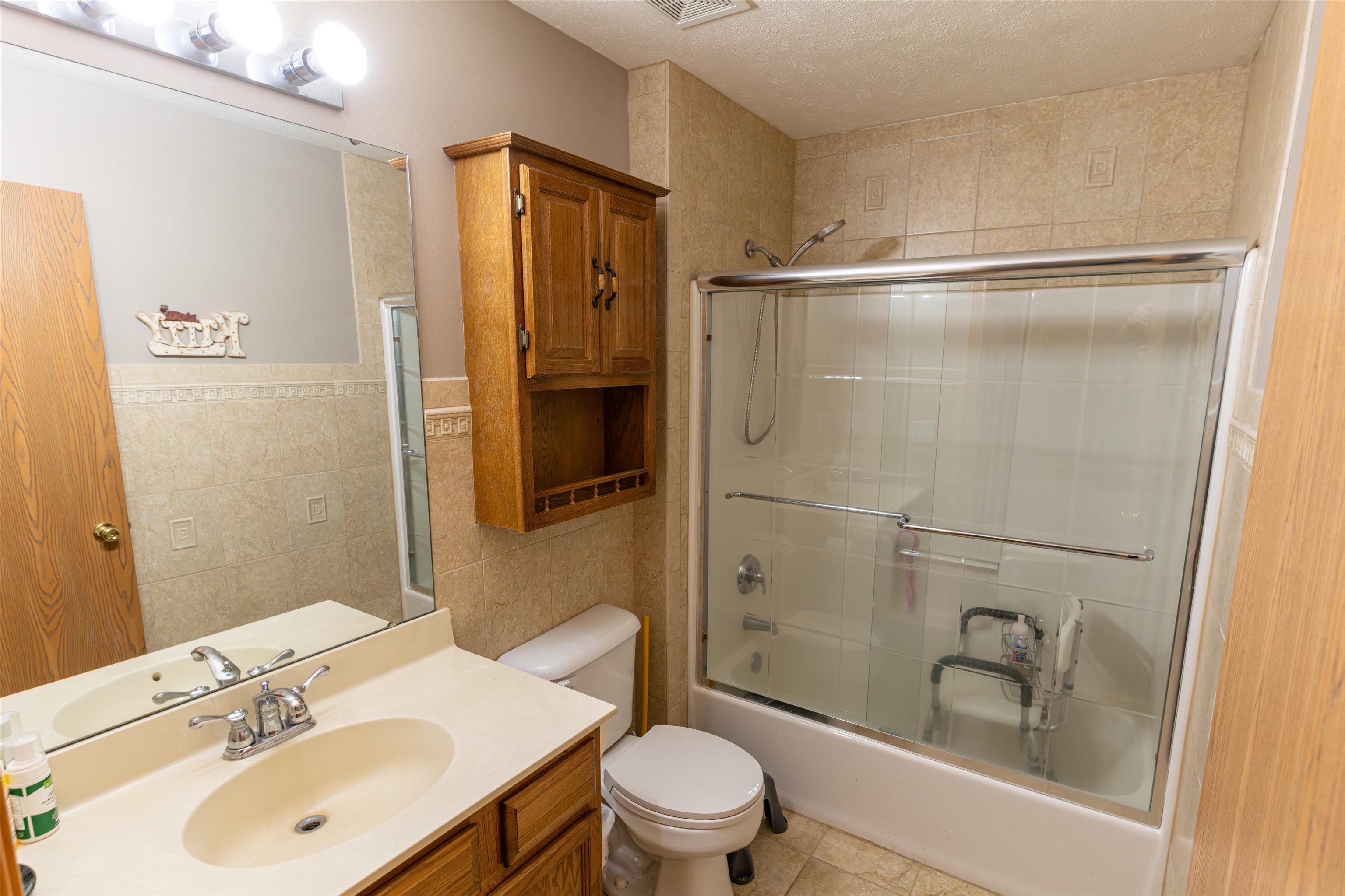 6502 Timberleaf Court Loves Park, IL 61111 - Photo 20 of 23 a bathroom with a sink a toilet and shower