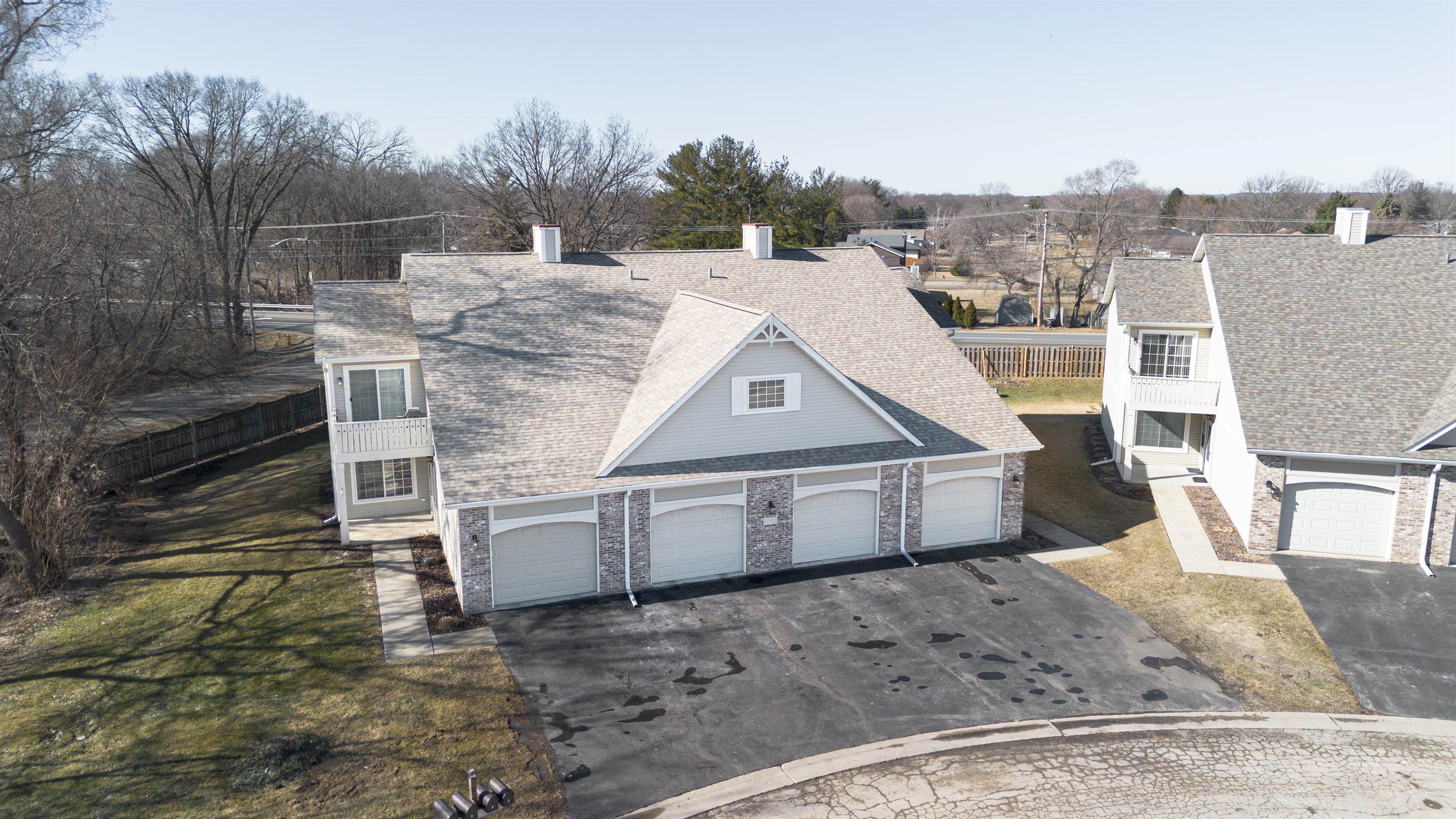 6502 Timberleaf Court Loves Park, IL 61111 - Photo 2 of 23 a view of a white house next to a yard