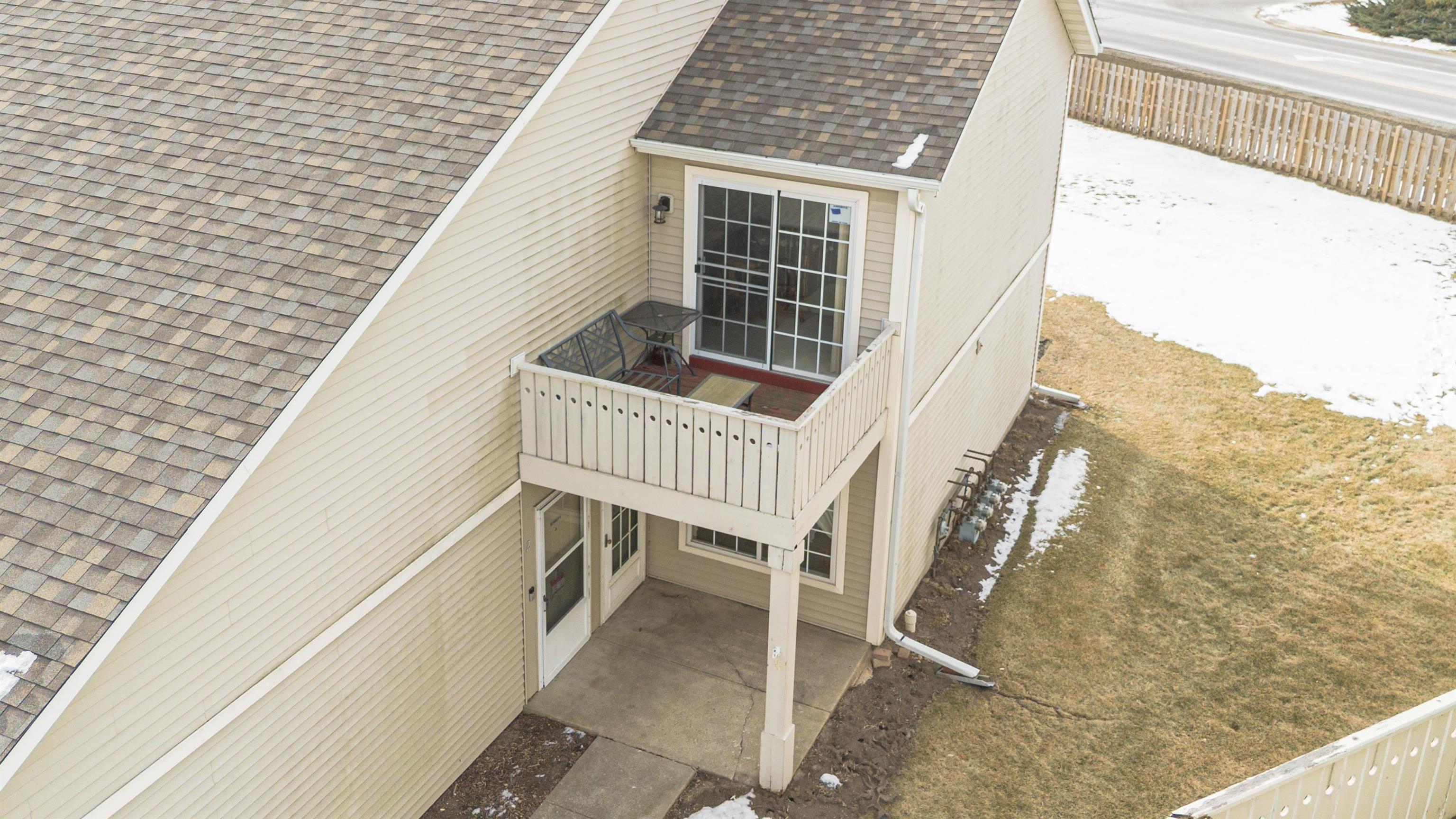 6502 Timberleaf Court Loves Park, IL 61111 - Photo 5 of 23 a balcony with table and chairs