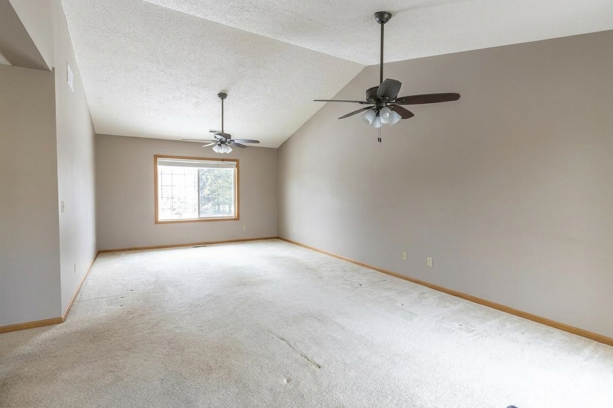6502 Timberleaf Court Loves Park, IL 61111 - Photo 7 of 23 a view of a room with a ceiling fan and window