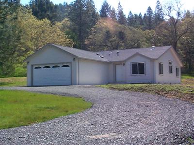22613 East Side Road Willits, CA 95490 - Photo 1 of 9 a front view of a house with a garden and yard