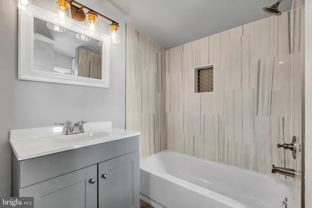 a bathroom with a sink and a bathtub