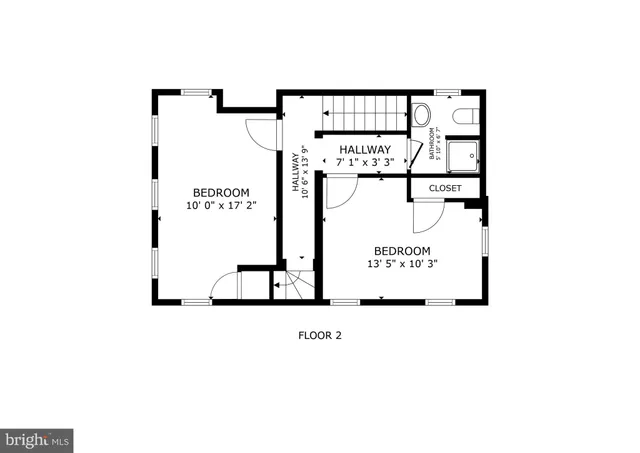 a picture of a bench in front of a building