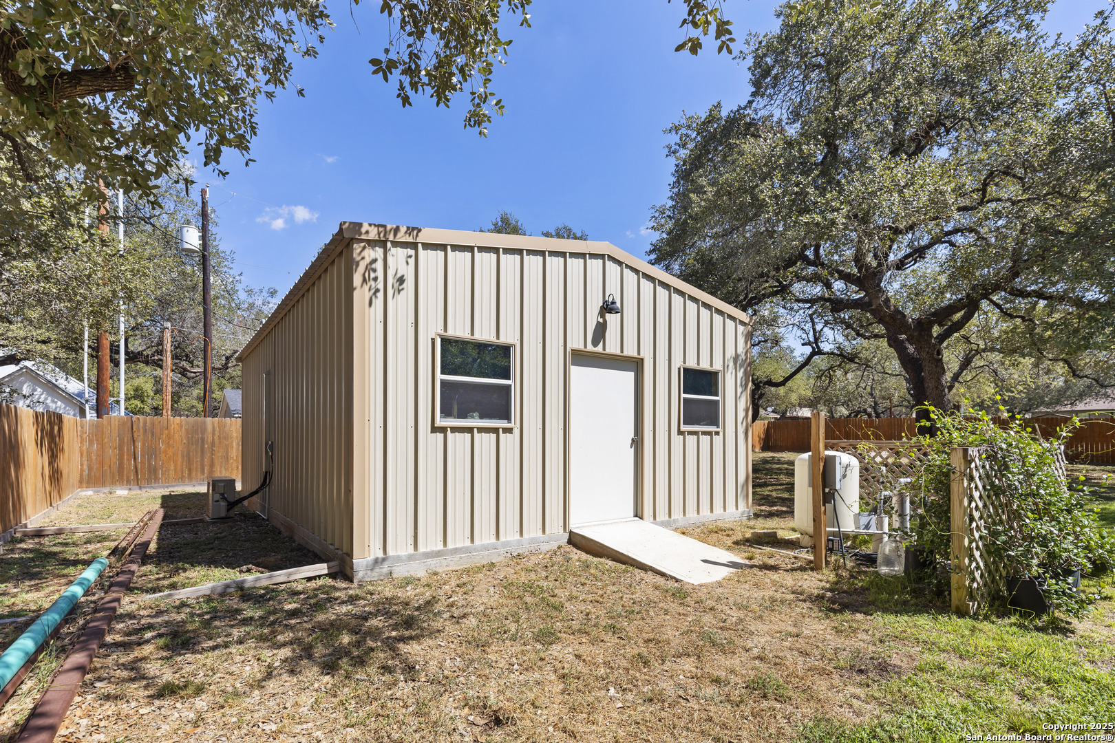 606 Ingram Road Devine, TX 78016 - Photo 27 of 36 a view of a house with a yard