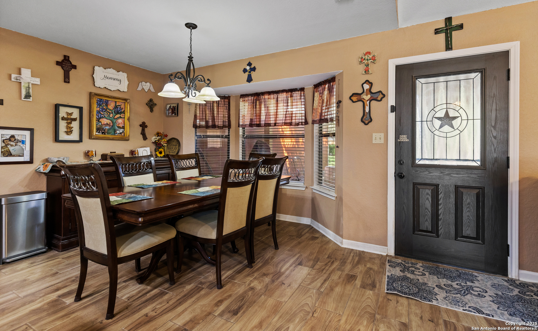 606 Ingram Road Devine, TX 78016 - Photo 9 of 36 a view of a dining room with furniture window and wooden floor