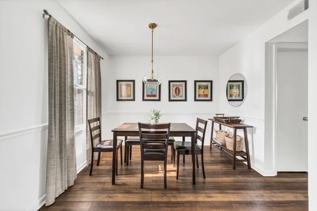 a kitchen with a refrigerator and a stove top oven