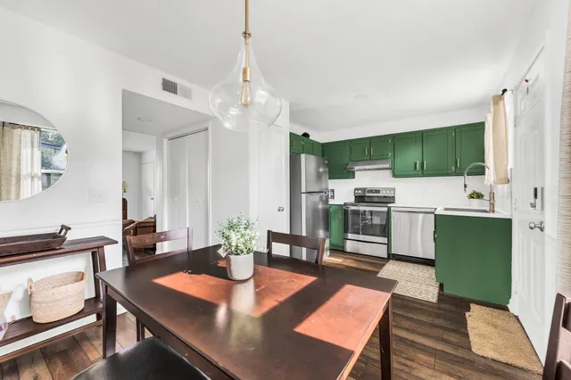 a view of dining room with furniture wooden floor and window