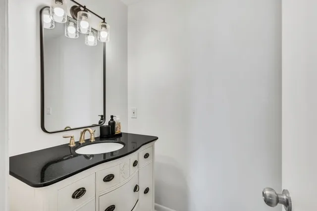 a living room with furniture large window and a fireplace