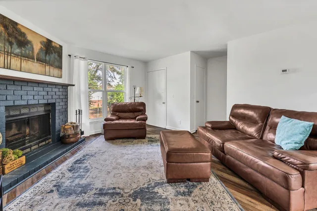a bedroom with a bed closet and a dresser