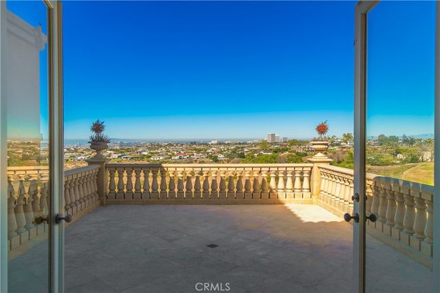 a view of a balcony with an ocean view
