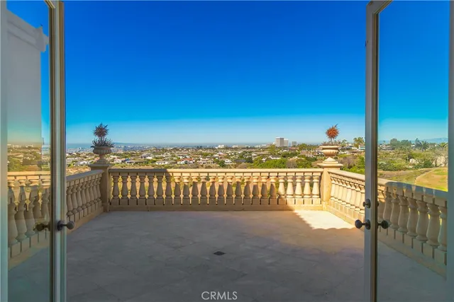 a view of a balcony with an ocean view