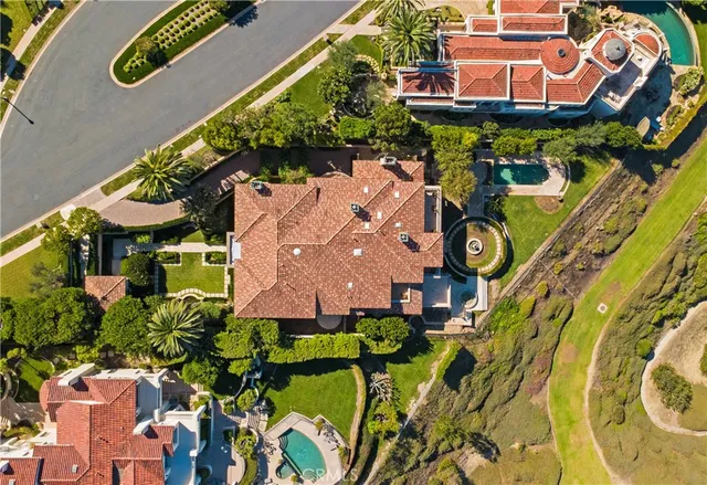an aerial view of a residential building with a street sign on a wall
