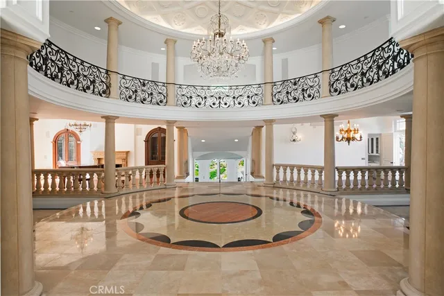 a lobby with a chandelier and living room